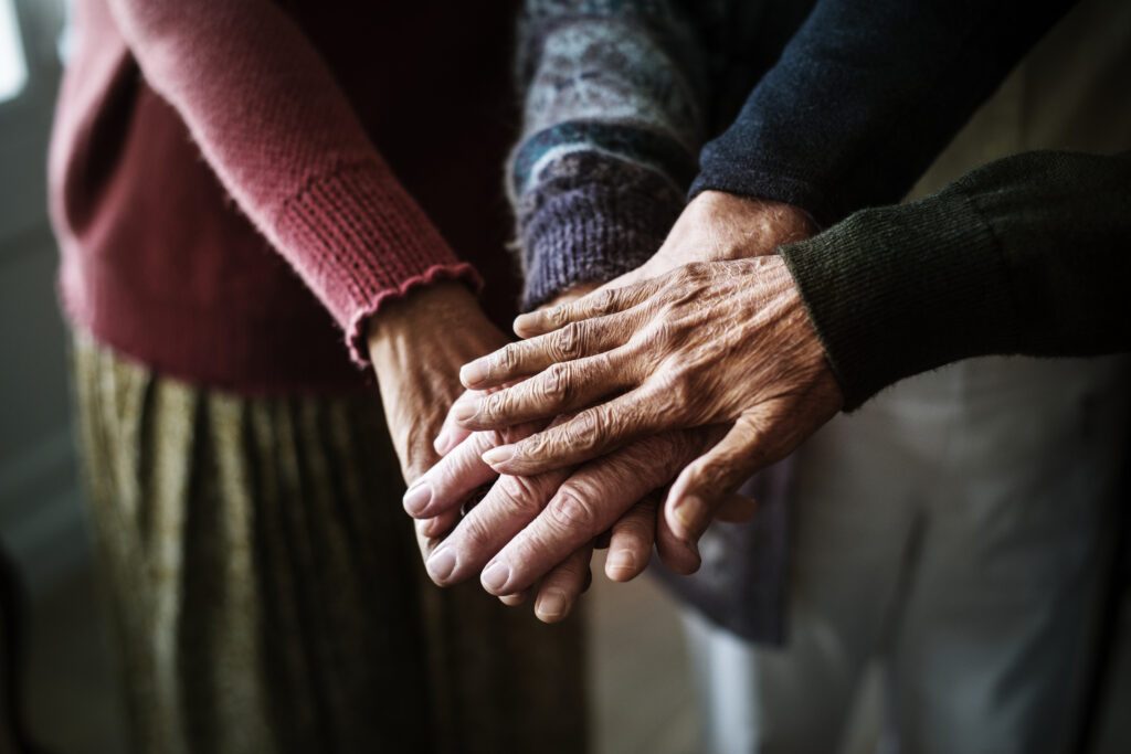 Elderly hands put together in church